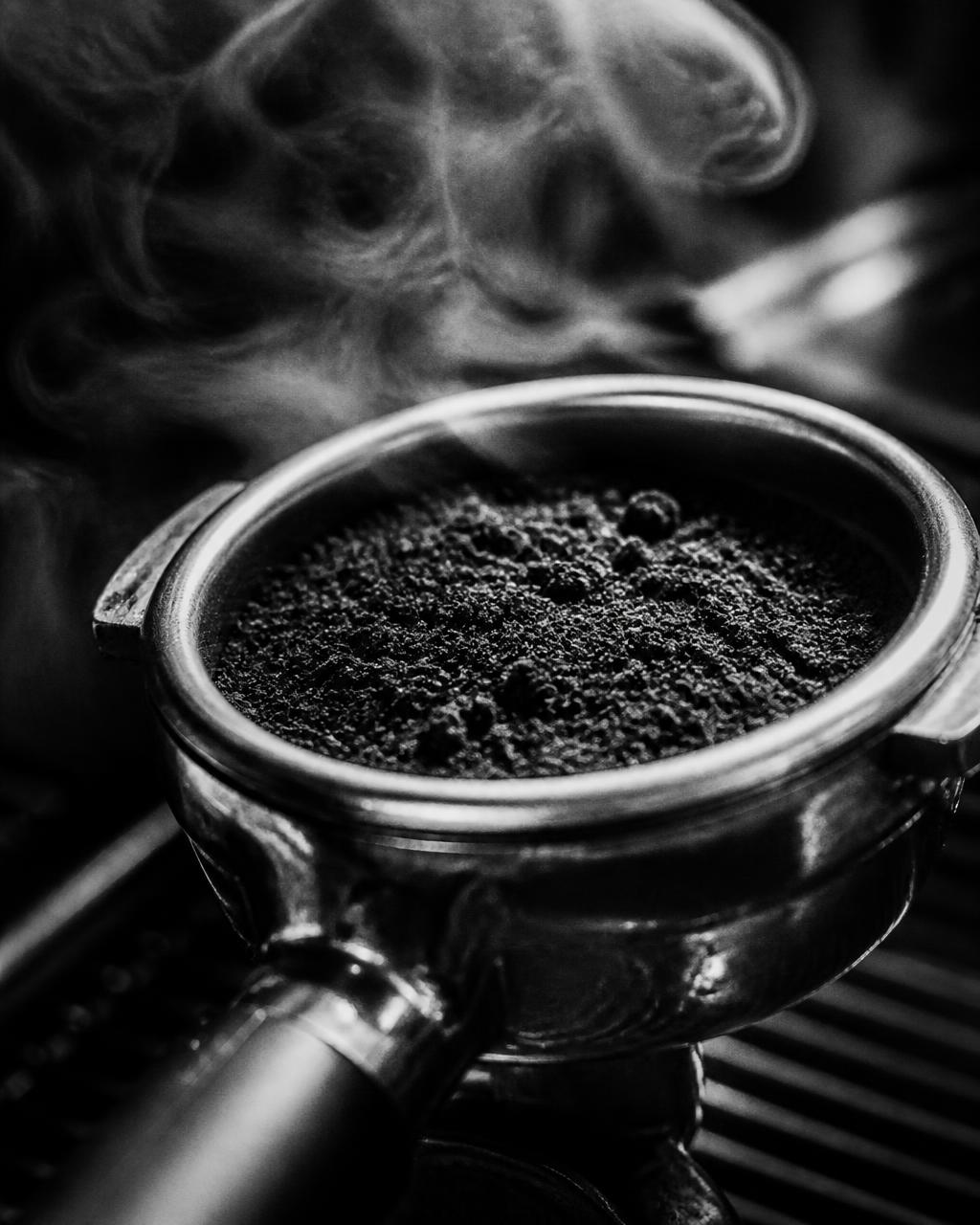 Close-up of freshly ground coffee in a portafilter